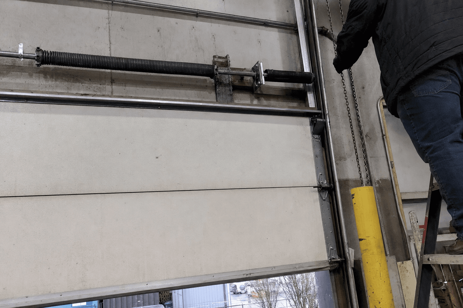 Why a Warehouse Overhead Door Drifts Down and What to Check First